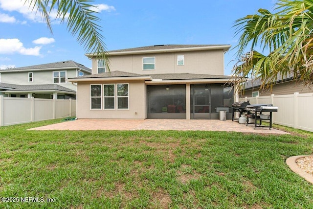 back of house with a patio, a sunroom, and stucco siding