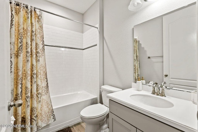 bathroom featuring shower / bath combo, wood finished floors, toilet, and vanity