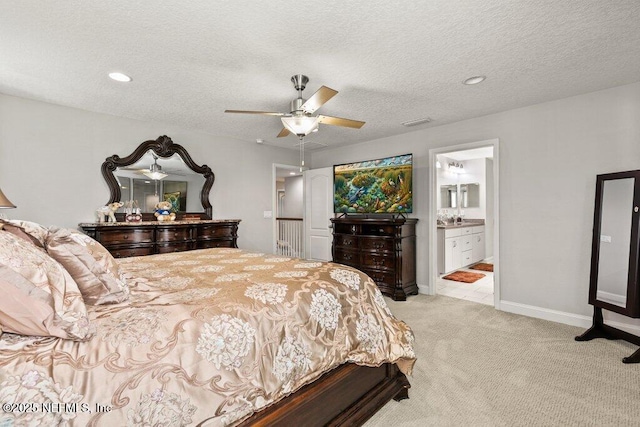 carpeted bedroom with recessed lighting, a ceiling fan, baseboards, and connected bathroom