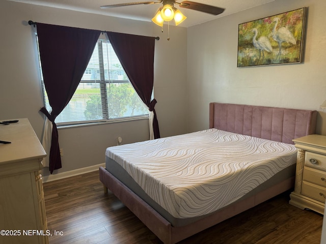 bedroom featuring dark wood-style floors, baseboards, and ceiling fan
