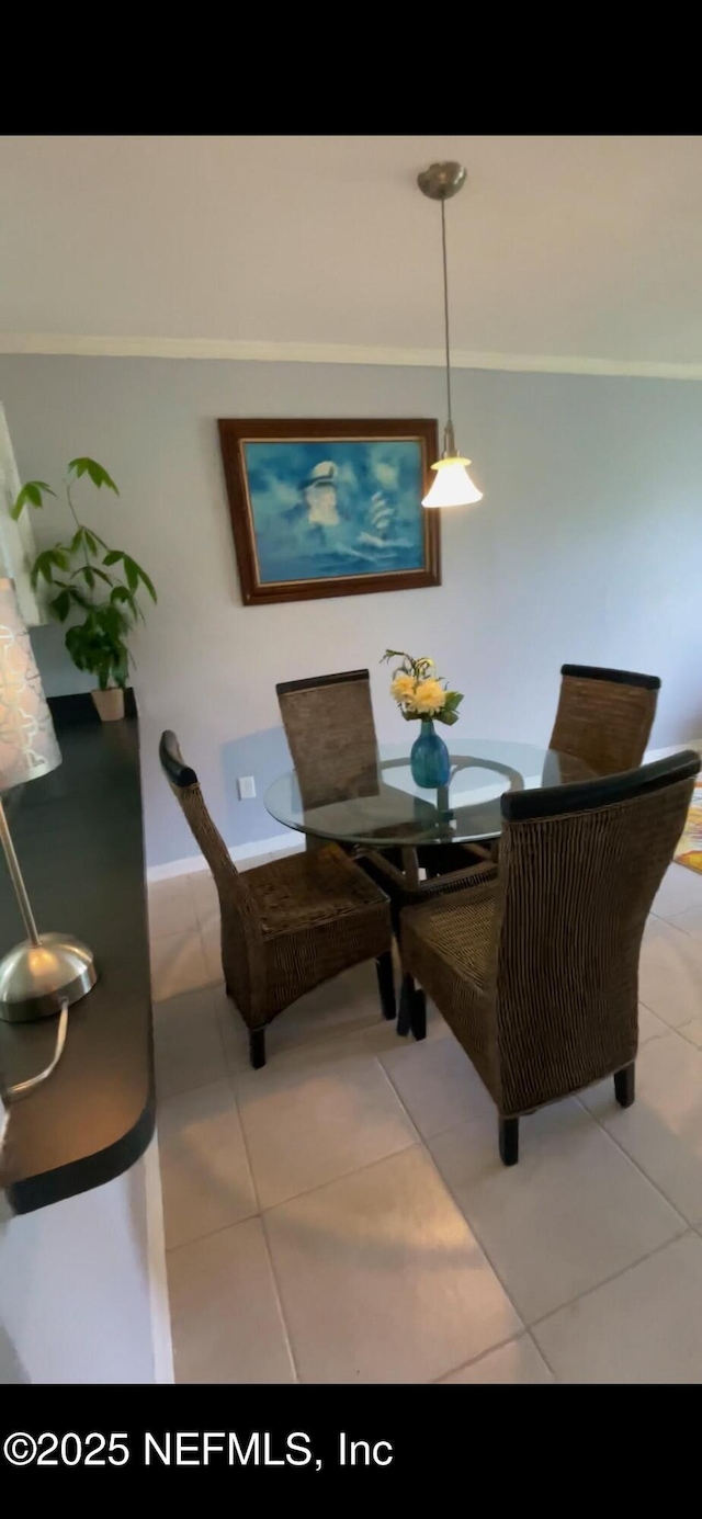 dining space with tile patterned floors and baseboards