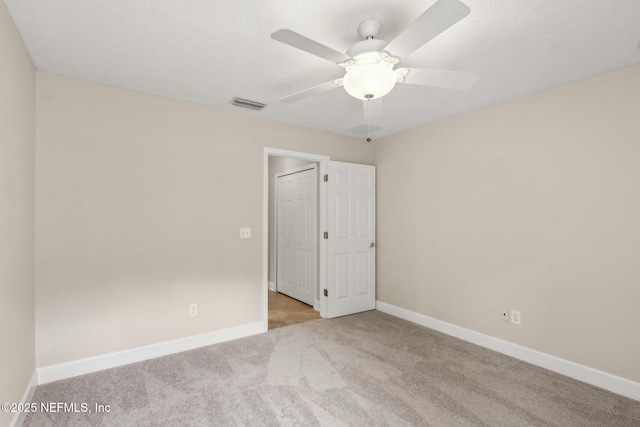2214 Links Dr, Fleming Island, FL 32003 - spare room featuring carpet, baseboards, and ceiling fan
