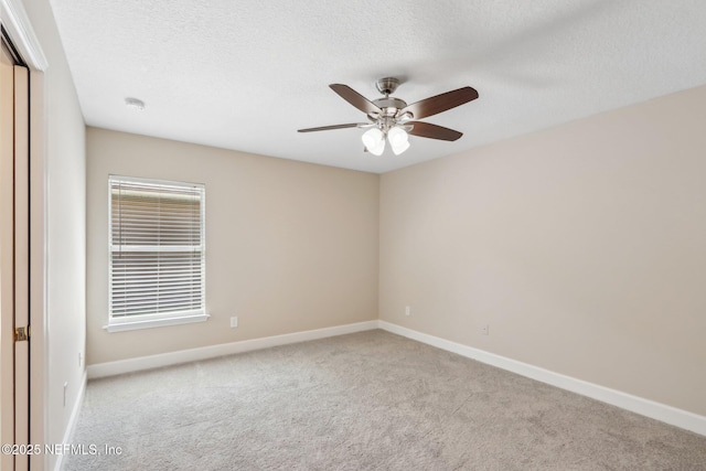 2214 Links Dr, Fleming Island, FL 32003 - carpeted spare room featuring a ceiling fan, baseboards, a smoke detector, and a textured ceiling