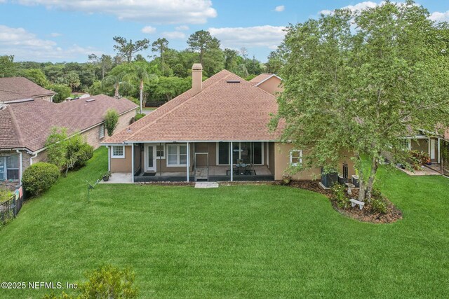 2214 Links Dr, Fleming Island, FL 32003 - back of house with a patio, a chimney, roof with shingles, and stucco siding