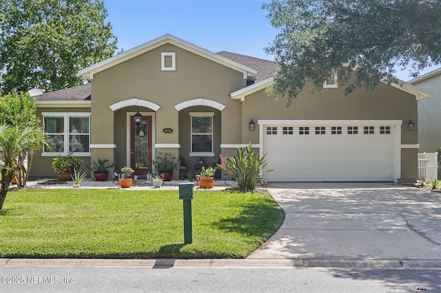 4956 Cypress Links Blvd, Elkton, FL 32033 - view of front of house featuring a garage, concrete driveway, stucco siding, and a front lawn