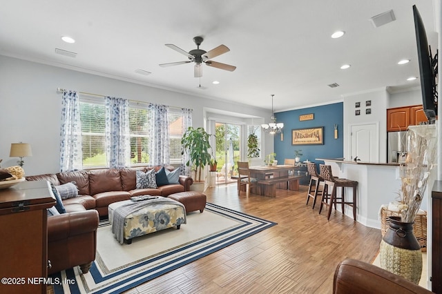4956 Cypress Links Blvd, Elkton, FL 32033 - living room featuring healthy amount of natural light, ceiling fan, a chandelier, recessed lighting, and ornamental molding