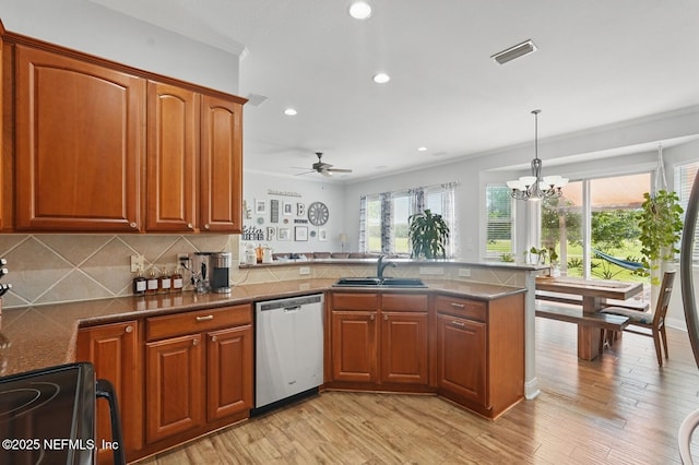 4956 Cypress Links Blvd, Elkton, FL 32033 - kitchen with dishwasher, a peninsula, a sink, recessed lighting, and black / electric stove