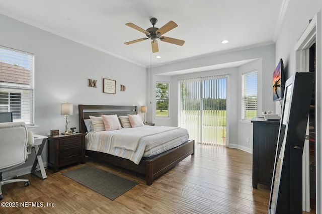 4956 Cypress Links Blvd, Elkton, FL 32033 - bedroom with access to outside, multiple windows, wood finished floors, crown molding, and recessed lighting