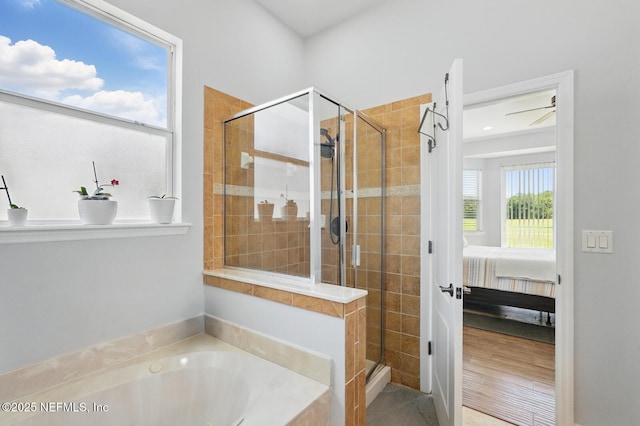 4956 Cypress Links Blvd, Elkton, FL 32033 - full bath with a bath, ensuite bathroom, a stall shower, and a ceiling fan