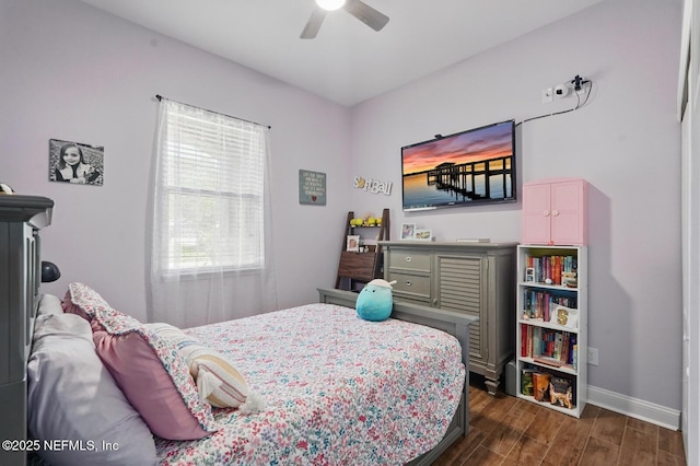 4956 Cypress Links Blvd, Elkton, FL 32033 - bedroom featuring dark wood finished floors, baseboards, and a ceiling fan