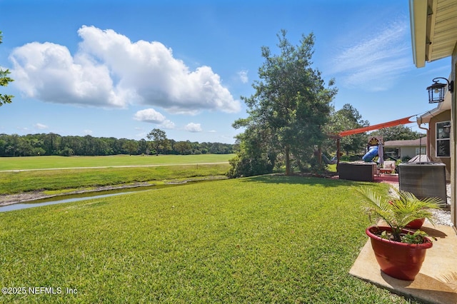 4956 Cypress Links Blvd, Elkton, FL 32033 - view of grassy yard with view of golf course and a water view
