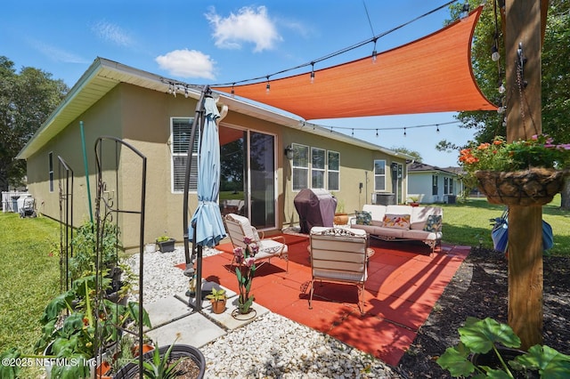 4956 Cypress Links Blvd, Elkton, FL 32033 - rear view of house featuring an outdoor living space, a patio, stucco siding, and a yard