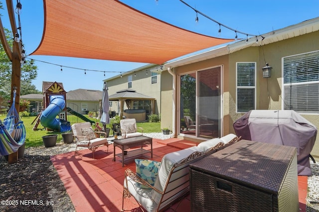 4956 Cypress Links Blvd, Elkton, FL 32033 - view of patio featuring an outdoor hangout area, a gazebo, grilling area, and a playground