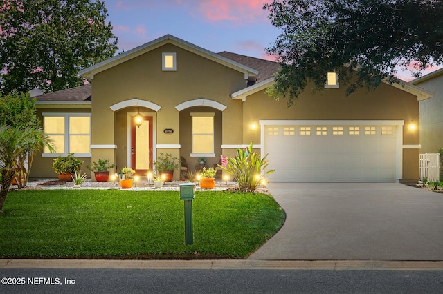 4956 Cypress Links Blvd, Elkton, FL 32033 - view of front of property featuring stucco siding, driveway, and a garage
