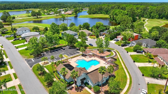 4956 Cypress Links Blvd, Elkton, FL 32033 - drone / aerial view of a large body of water, a pool area, a golf course, and a heavily wooded area