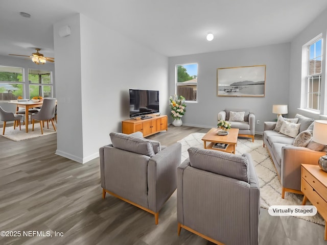 3124 Hidden Lake Cv, Middleburg, FL 32068 - living area featuring wood finished floors, ceiling fan, and baseboards