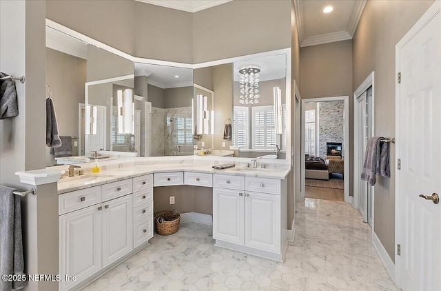 201 Royal Tern Rd N, Ponte Vedra Beach, FL 32082 - ensuite bathroom featuring double vanity, tiled shower, ornamental molding, recessed lighting, and a glass covered fireplace