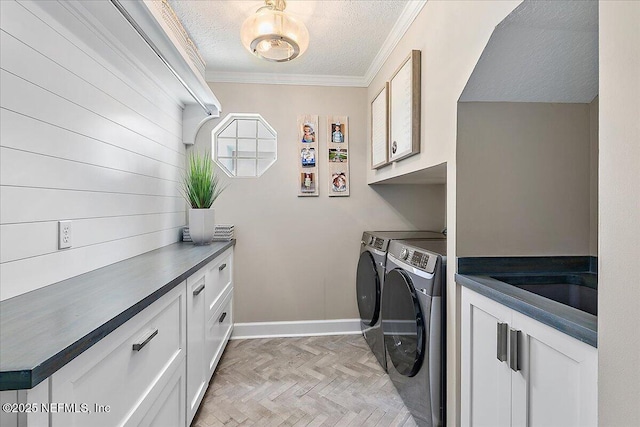 201 Royal Tern Rd N, Ponte Vedra Beach, FL 32082 - laundry room with washing machine and clothes dryer, a textured ceiling, cabinet space, crown molding, and healthy amount of natural light