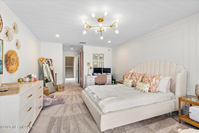 201 Royal Tern Rd N, Ponte Vedra Beach, FL 32082 - bedroom featuring light colored carpet, a chandelier, recessed lighting, and a textured ceiling