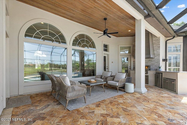 201 Royal Tern Rd N, Ponte Vedra Beach, FL 32082 - view of patio / terrace featuring an outdoor kitchen, a ceiling fan, glass enclosure, and an outdoor living space