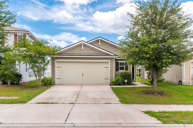 8244 Meadow Walk Ln, Jacksonville, FL 32256 - view of front of home with driveway, an attached garage, and a front yard