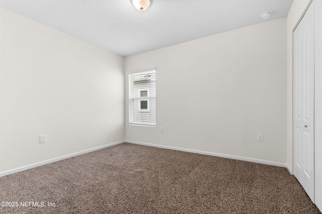 8244 Meadow Walk Ln, Jacksonville, FL 32256 - carpeted spare room featuring baseboards and a smoke detector