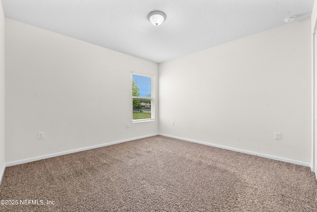8244 Meadow Walk Ln, Jacksonville, FL 32256 - carpeted empty room with baseboards and a smoke detector