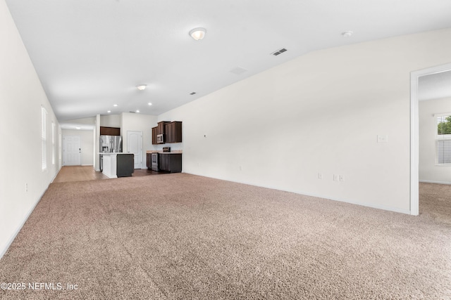 8244 Meadow Walk Ln, Jacksonville, FL 32256 - unfurnished living room with lofted ceiling and light colored carpet