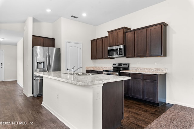 8244 Meadow Walk Ln, Jacksonville, FL 32256 - kitchen featuring appliances with stainless steel finishes, a sink, dark brown cabinets, dark wood finished floors, and recessed lighting