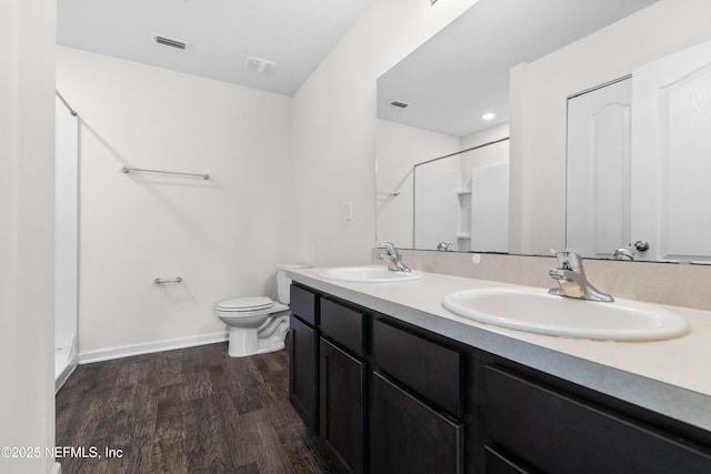 8244 Meadow Walk Ln, Jacksonville, FL 32256 - full bathroom featuring a shower, wood finished floors, toilet, double vanity, and baseboards