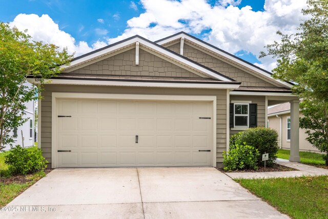 8244 Meadow Walk Ln, Jacksonville, FL 32256 - view of front facade featuring driveway and a garage