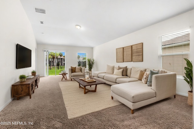 8244 Meadow Walk Ln, Jacksonville, FL 32256 - living room with lofted ceiling, carpet flooring, and baseboards
