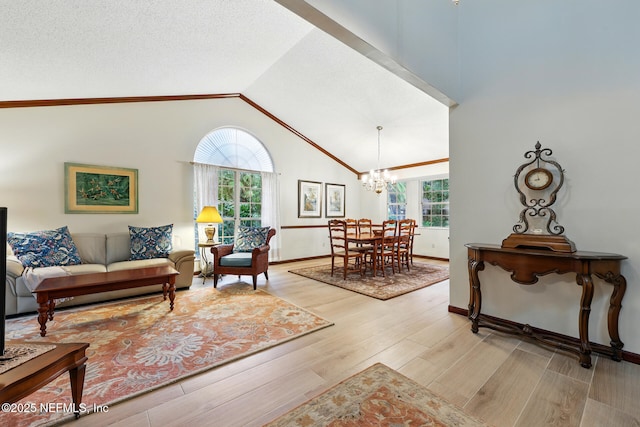 1917 Lakeside Dr S, Fernandina Beach, FL 32034 - living room with a chandelier, healthy amount of natural light, light wood finished floors, and high vaulted ceiling