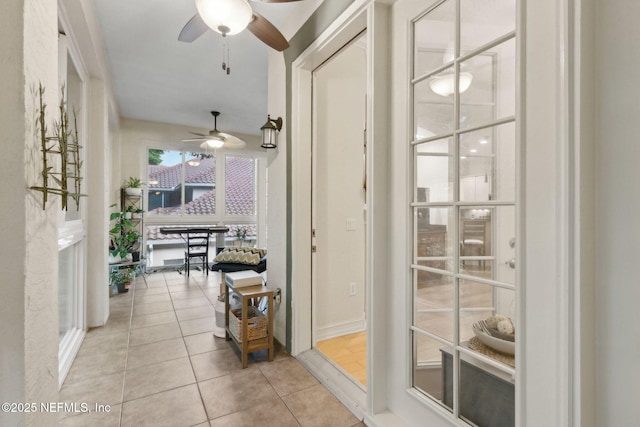 95050 Barclay Pl Unit 5B, Fernandina Beach, FL 32034 - doorway with ceiling fan and light tile patterned flooring