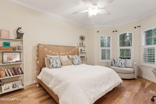95050 Barclay Pl Unit 5B, Fernandina Beach, FL 32034 - bedroom featuring wood finished floors, ornamental molding, baseboards, and a ceiling fan