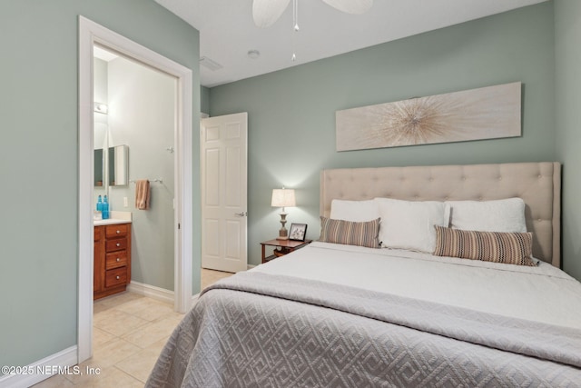 95050 Barclay Pl Unit 5B, Fernandina Beach, FL 32034 - bedroom with light tile patterned floors, ensuite bathroom, baseboards, and a ceiling fan