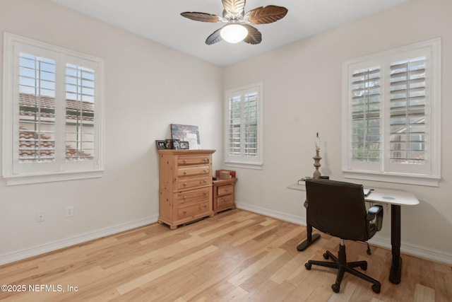 95050 Barclay Pl Unit 5B, Fernandina Beach, FL 32034 - office area with wood finished floors, ceiling fan, and healthy amount of natural light