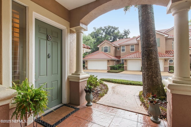 95050 Barclay Pl Unit 5B, Fernandina Beach, FL 32034 - property entrance with stucco siding, a porch, and a residential view