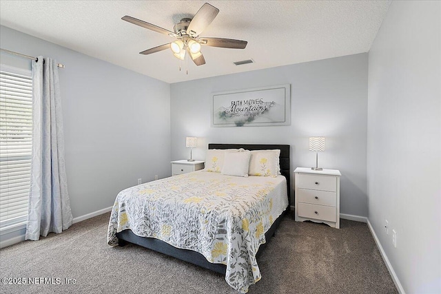 bedroom featuring carpet floors, baseboards, a ceiling fan, and a textured ceiling