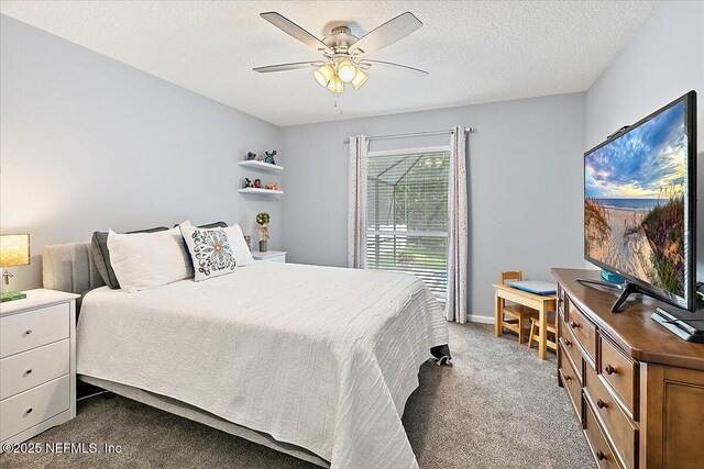 bedroom featuring dark carpet, ceiling fan, a textured ceiling, and baseboards