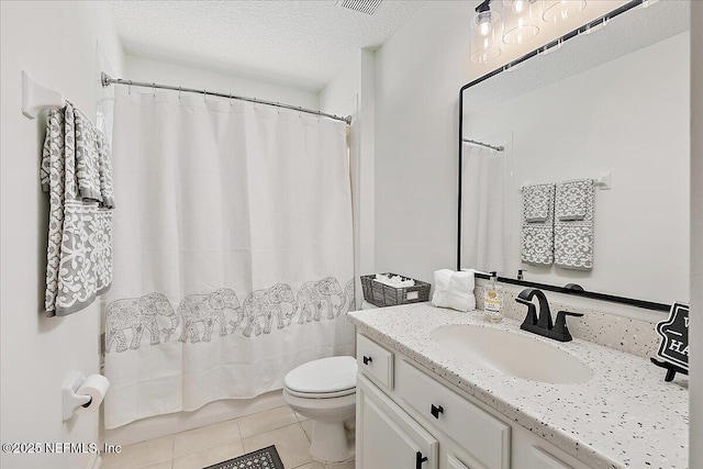 full bath with toilet, tile patterned floors, vanity, a textured ceiling, and shower / tub combo with curtain