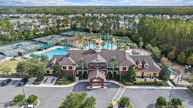 aerial view of a pool area and a forest