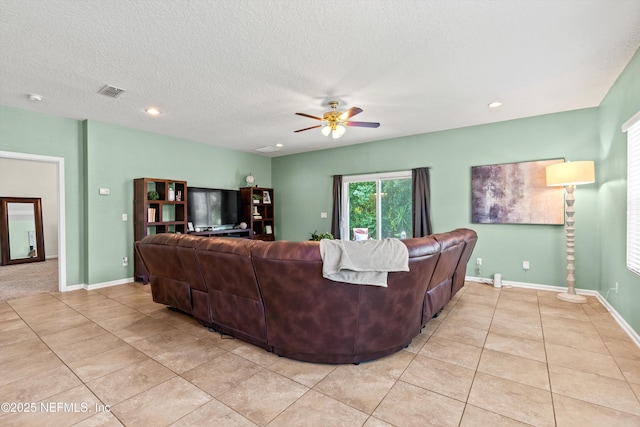 1479 King Rail Ln, Middleburg, FL 32068 - living area with light tile patterned floors, a ceiling fan, recessed lighting, a textured ceiling, and baseboards