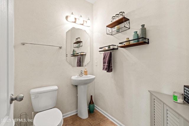 1479 King Rail Ln, Middleburg, FL 32068 - bathroom featuring toilet, tile patterned floors, and baseboards