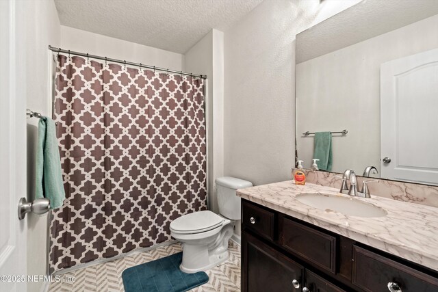 1479 King Rail Ln, Middleburg, FL 32068 - bathroom with a textured ceiling, toilet, vanity, and a shower with shower curtain