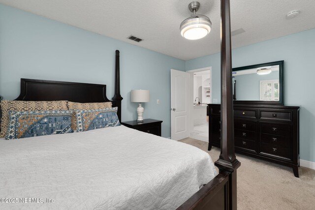 400 Big Tree Rd, Ponte Vedra Beach, FL 32082 - bedroom featuring light carpet, baseboards, and a textured ceiling