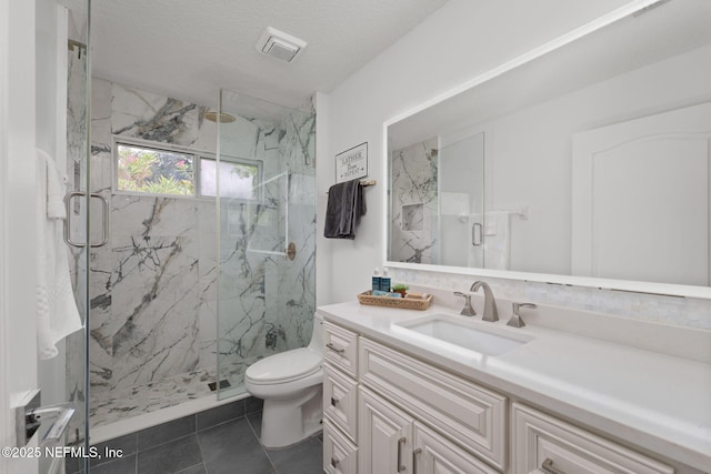 400 Big Tree Rd, Ponte Vedra Beach, FL 32082 - full bath with a marble finish shower, toilet, vanity, and tile patterned floors