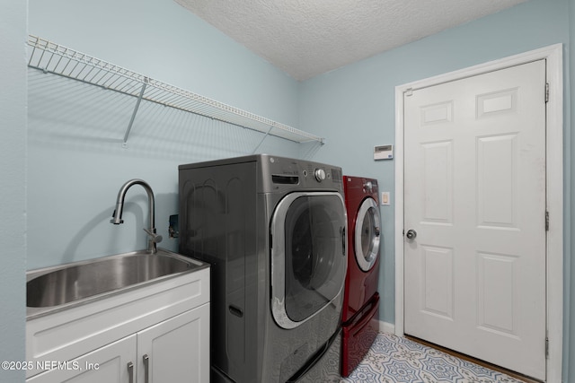 400 Big Tree Rd, Ponte Vedra Beach, FL 32082 - laundry area featuring separate washer and dryer, cabinet space, and a textured ceiling