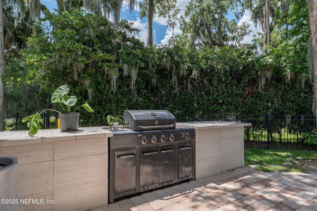 400 Big Tree Rd, Ponte Vedra Beach, FL 32082 - view of patio / terrace featuring an outdoor kitchen, fence, and grilling area