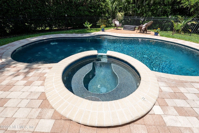 400 Big Tree Rd, Ponte Vedra Beach, FL 32082 - view of swimming pool with a pool with connected hot tub, a fenced backyard, and a patio
